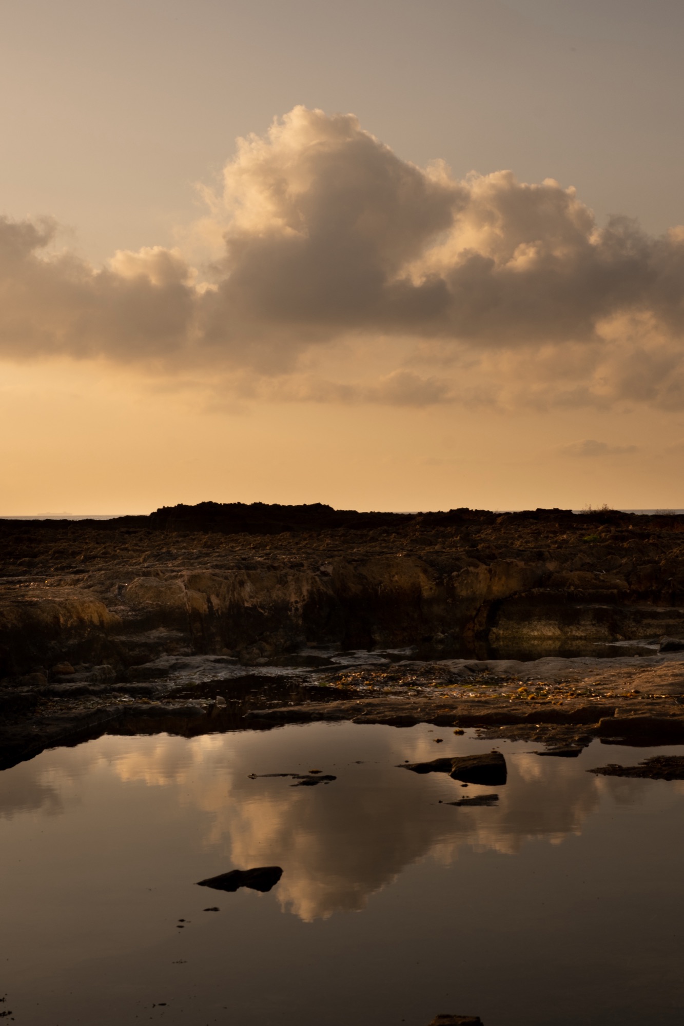 A rock pool reflecting the sky on the Jávea shore